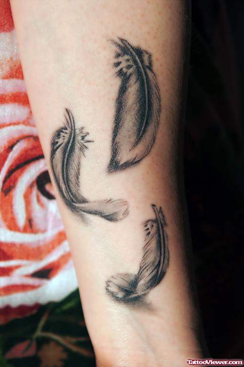 Awesome Grey Ink Feather Tattoo On Arm