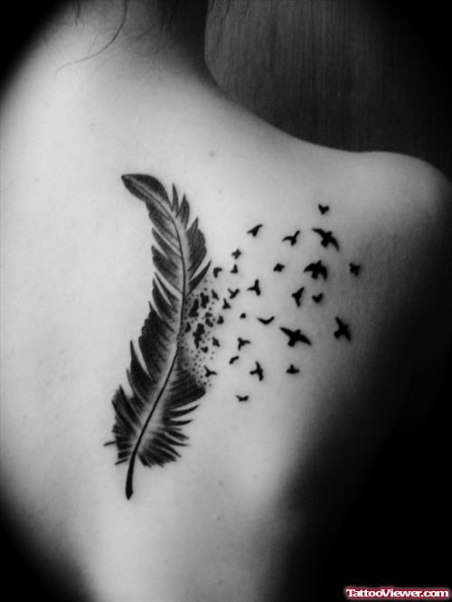 Bird Flying From Feather Tattoo On Back