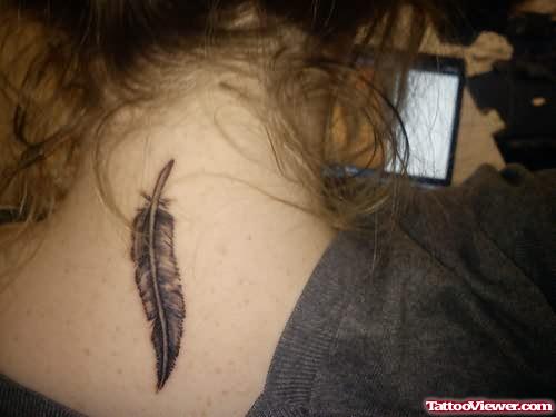 Small Black Feather Tattoo On Back Neck