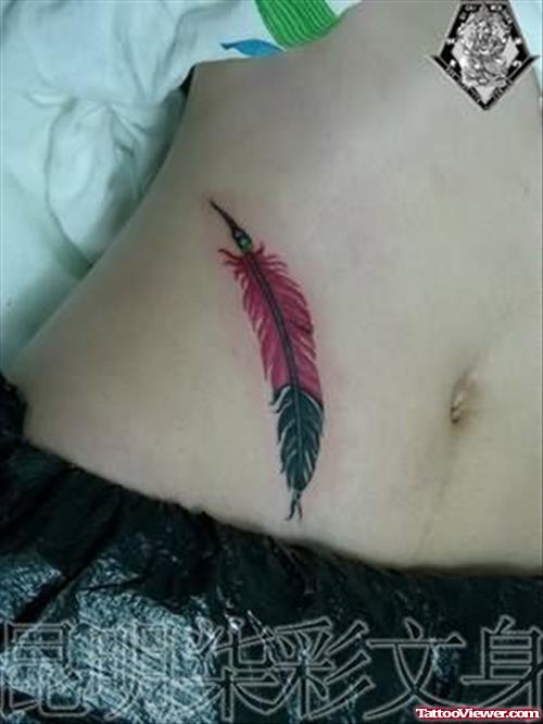 Coloured Feather Tattoo On Belly