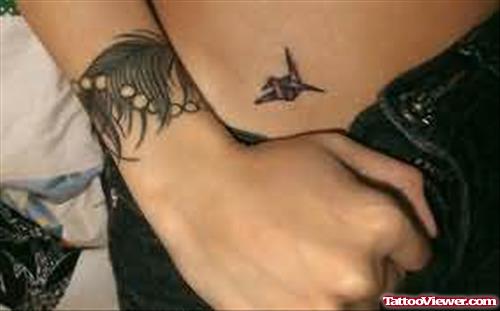 Tiny Bird Tattoo On Waist