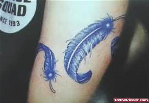 Blue Feather Tattoo On Body