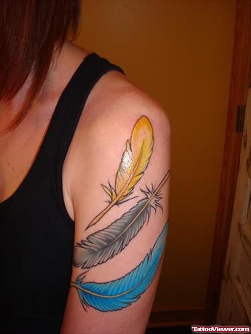 Blue And Yellow Tattoo On Shoulder