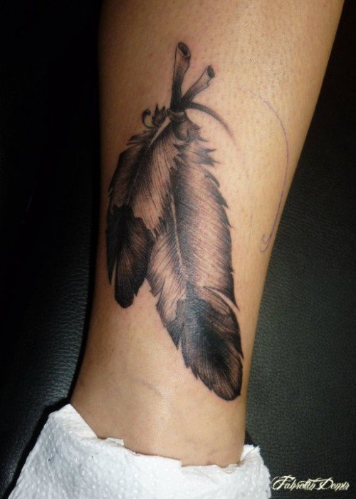 Grey Ink Feather Tattoo On Leg