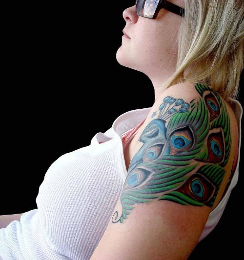 Girl With colored Peacock Feathers Tattoos On Shoulder