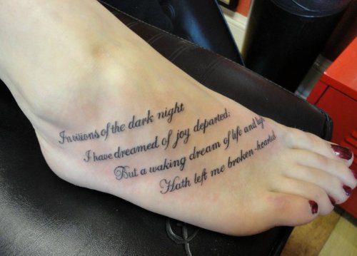 Girl With Lettering Feet Tattoo