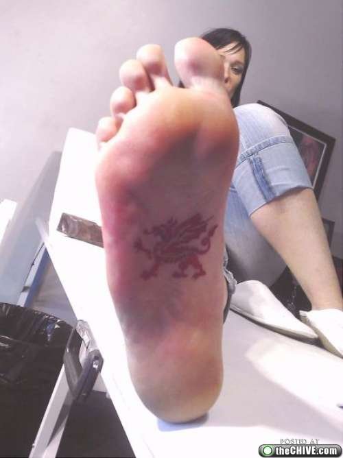 Red Dragon Under Feet Tattoo