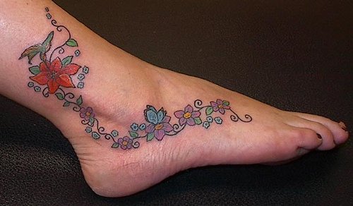 Cool Colored Flowers Feet Tattoo