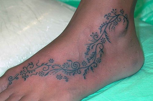 Grey Ink Swirl Feet Tattoo