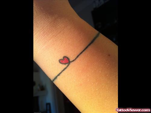 Tiny Red Heart Feminine Tattoo On Wrist