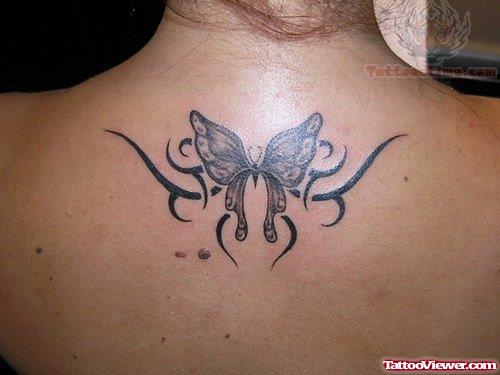 Tribal And Butterfly Feminine Tattoo On Upperback