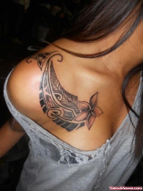 Grey Ink Flower And Tribal Feminine Tattoo On Collarbone