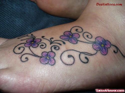 Purple Flowers Feminine Tattoo On Foot