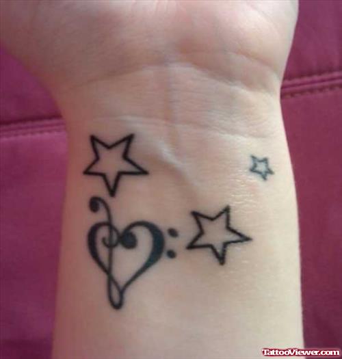 Stars And Heart Feminine Tattoo On Wrist