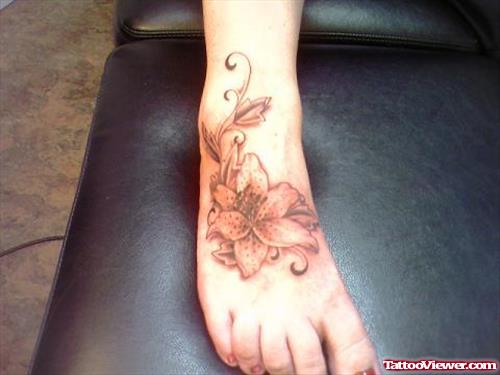 Grey Ink Feminine Flower Tattoo On Right Foot