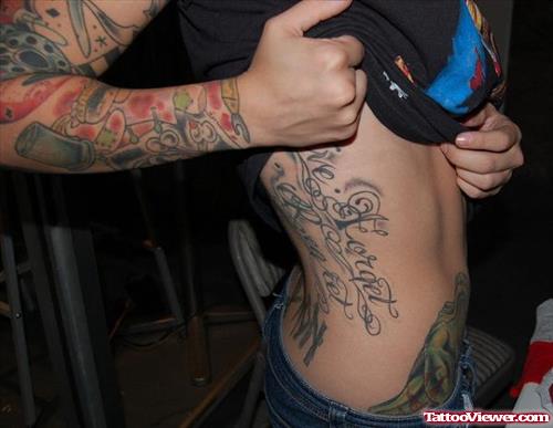 Feminine Tattoo On Sleeve And Side Rib