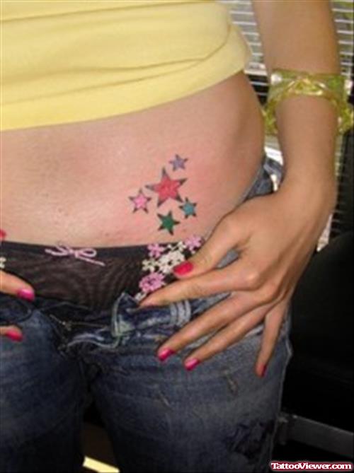Feminine Colored Stars Tattoos On Hip