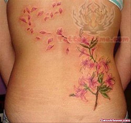Girl With Feminine Tattoo On Back