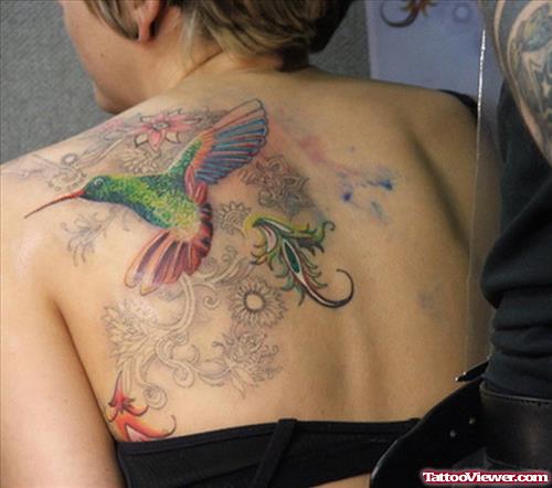 Flying Hummingbird And Feminine Tattoo On Upperback