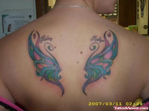 Colored Butterfly Wings Feminine Tattoo On Upperback