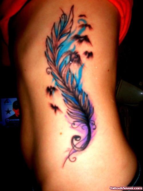Colored Feather And Flying Birds Feminine Tattoo On Side Rib