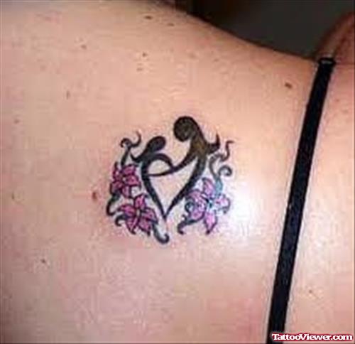 Black Tribal And Flowers Feminine Tattoo On Back Shoulder