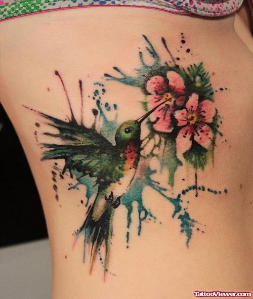 Flying Bird And Flowers Feminine Tattoo On Side Rib