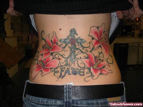 Feminine Flowers And Cross Tattoo On Lowerback