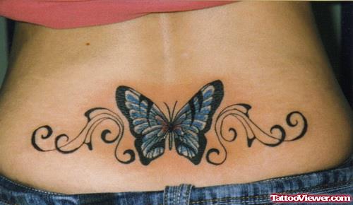 Blue Ink Butterfly Feminine Tattoo On Lowerback