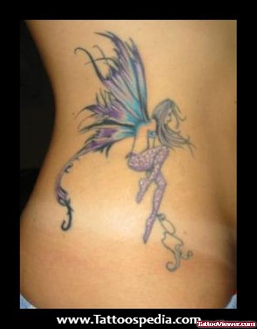 Colored Fairy Feminine Tattoo On Girl RIb Side