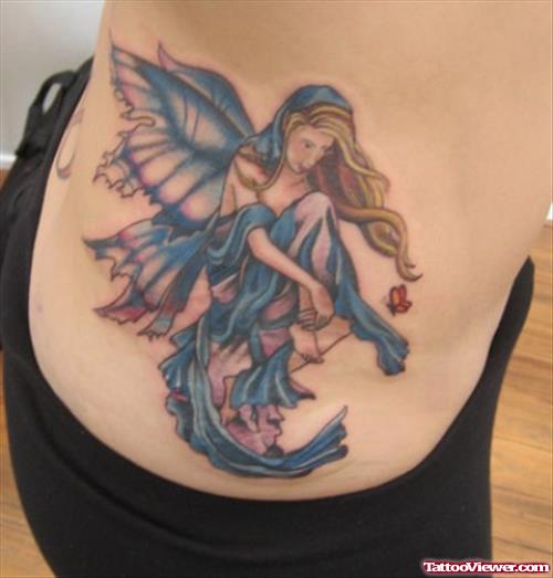 Blue Ink Feminine Fairy Tattoo On Side