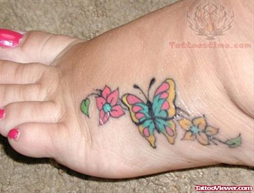 Feminine Colored Butterfly Tattoo On Foot
