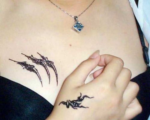 Feminine Tattoo On Girl Chest And Hand
