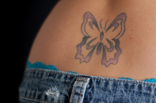 Butterfly Feminine Tattoo On Lowerback