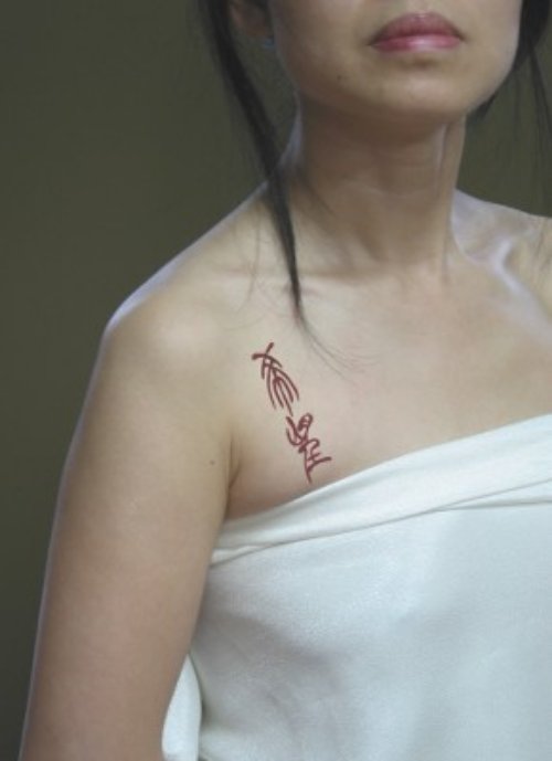 Unique Feminine Tattoo On Girl Chest