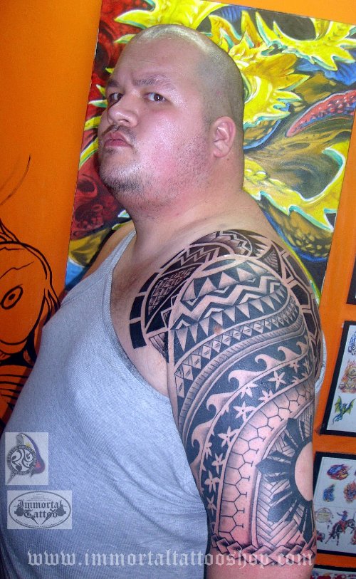 Attractive Man With Filipino Tattoo On Left Half Sleeve