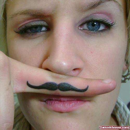 Girl With Black Mustache Finger Tattoo