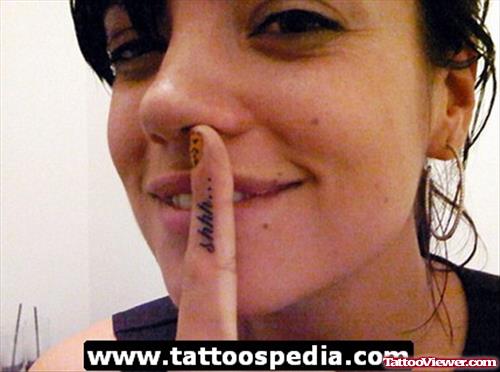 Beautiful Girl With Shhh Finger Tattoo