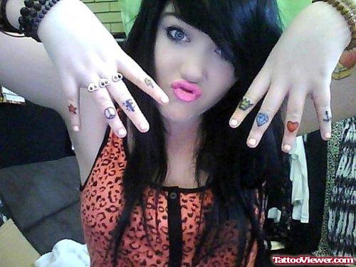 Symbols Tattoos On Girl Fingers