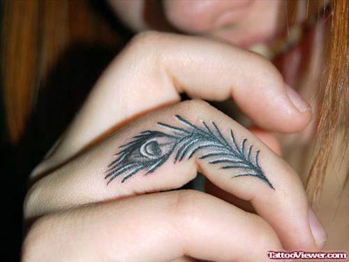 Beautiful Peacock Feather Finger Tattoo