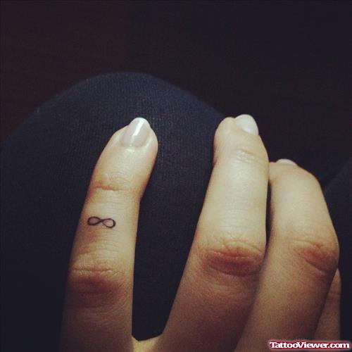 Small Infinity Symbol Finger Tattoo