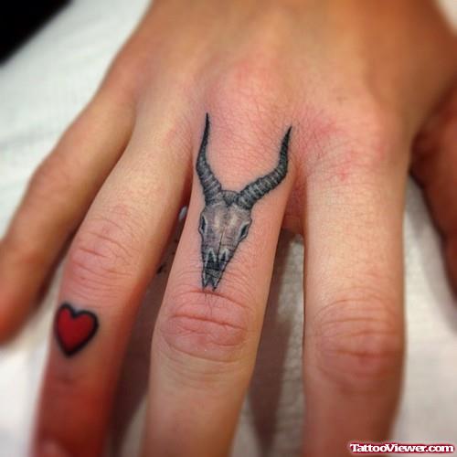 Tiny Red Heart And Deer Skull Finger Tattoos