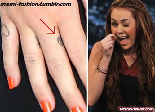 Miley Cyrus Peace Symbol Finger Tattoo