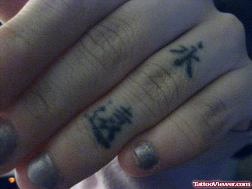 Black Ink Small Chinese Symbols Finger Tattoo
