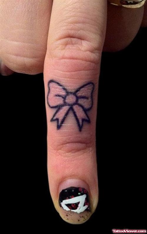 Small Bow Finger Tattoo
