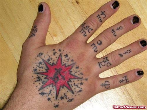 Red Ink Star And Geometric Symbols Finger Tattoo