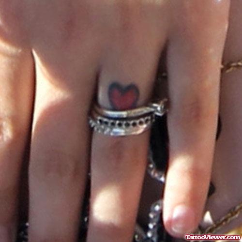 Tiny Red Heart Finger Tattoo