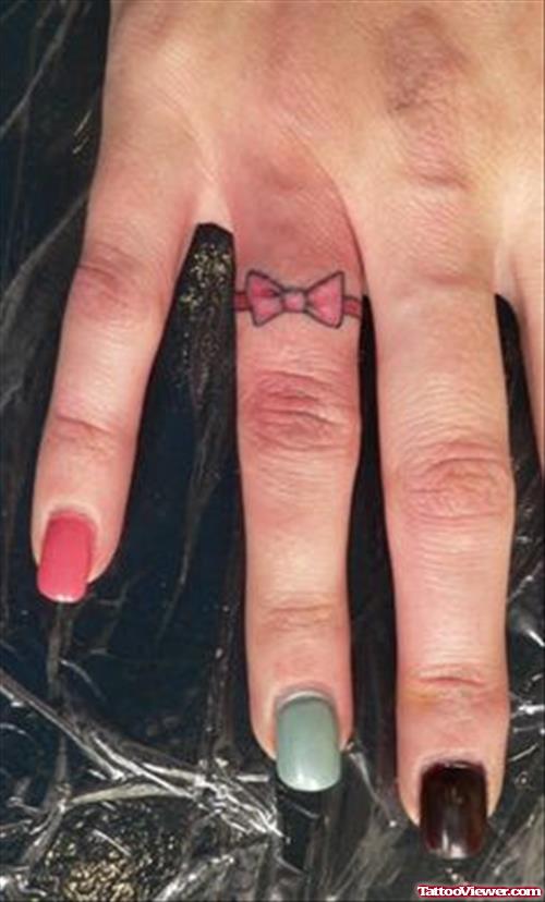 Pink Bow Finger Tattoo