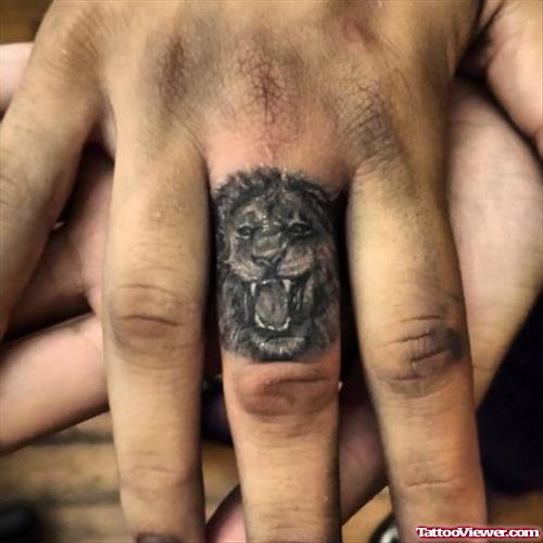 Grey Ink Roaring Lion Head Finger Tattoo