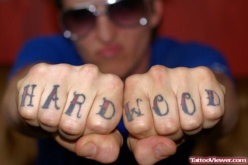 Red Ink Hard Wood Finger Tattoos